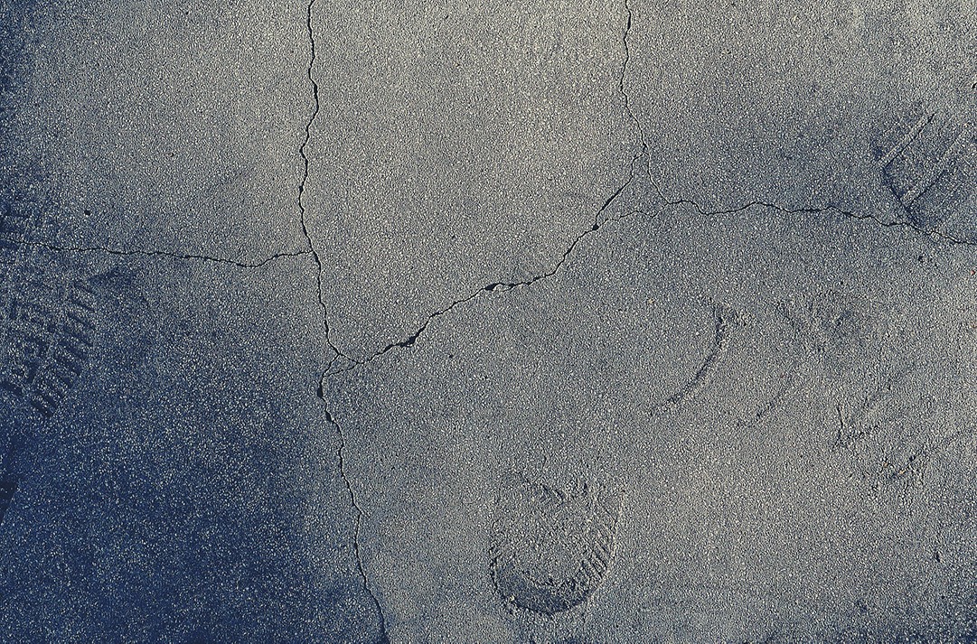 Boot prints in asphalt